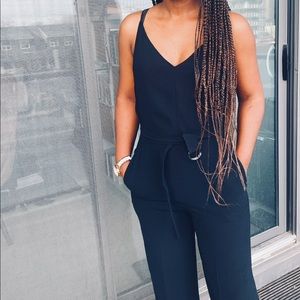 Aritzia Babaton black jumpsuit with belt. Worn once. excellent condition. Size 6